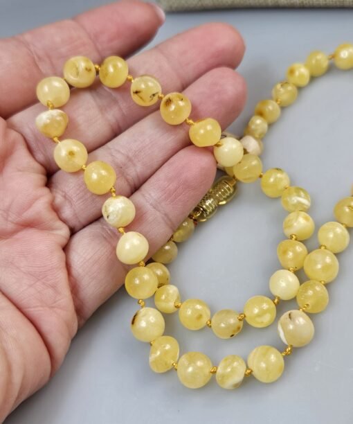 Balto gintaro karoliai Apvalūs karoliai